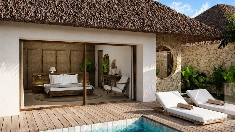 The Villas — bedroom opening onto a private deck and pool
